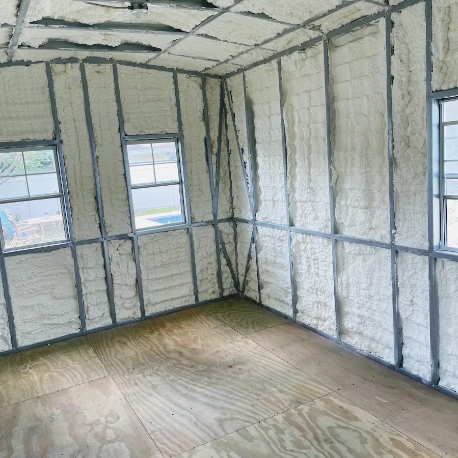 Closed-cell spray foam insulation applied to wall cavities in a residential project in Broussard